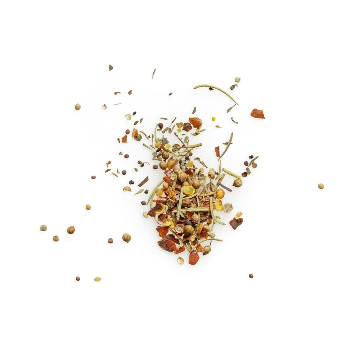 Crimson saffron threads scattered loosely on a white surface